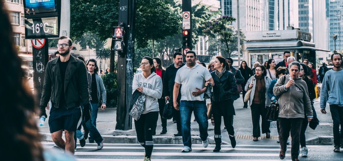 People walking on pedestrian lane during a business daytime