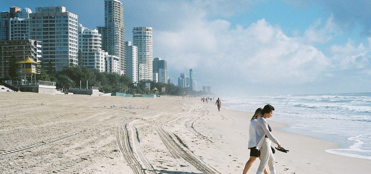 Two woman walking down Surfer's Paradise in Queensland