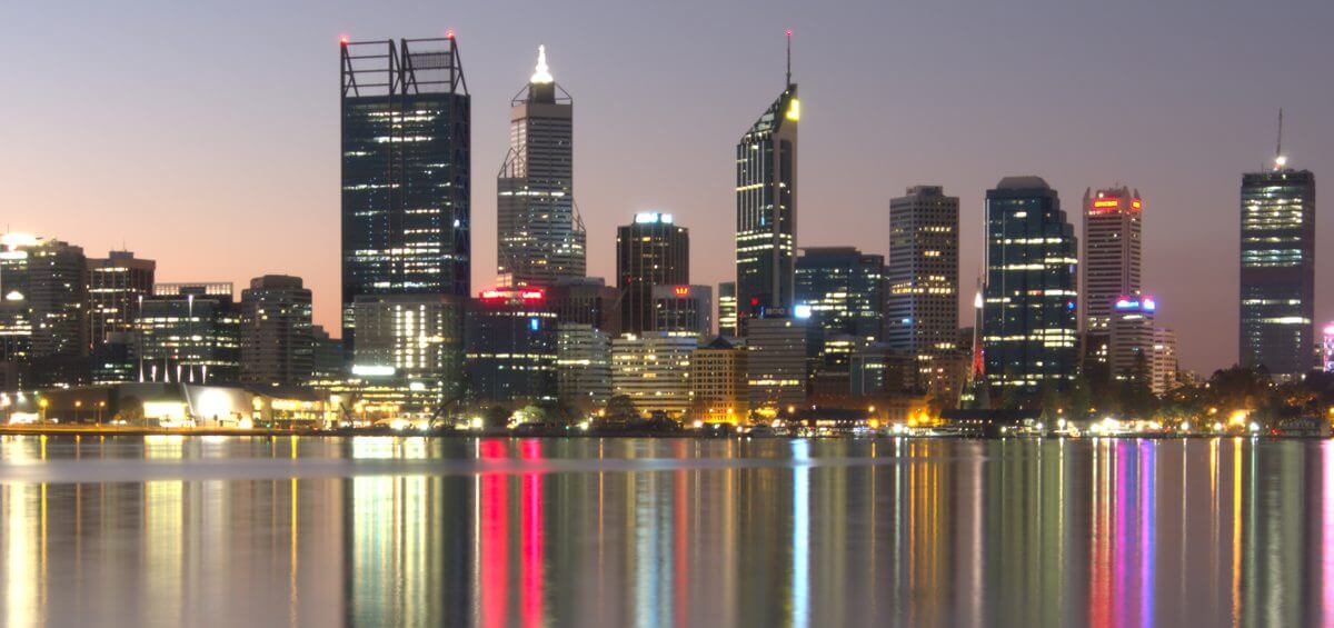 Perth city in the night time with illuminating lights reflected in water