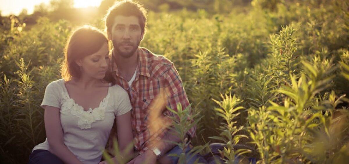 Couple posing in a regional field