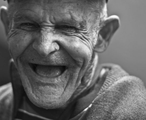 An elderly man full of happiness