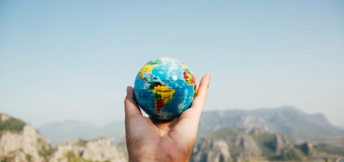 World globe in a person's hand