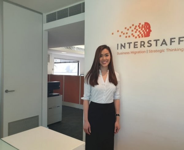 Registered migration agent (MARN: 1808239) Melissa Phan standing in the Interstaff office