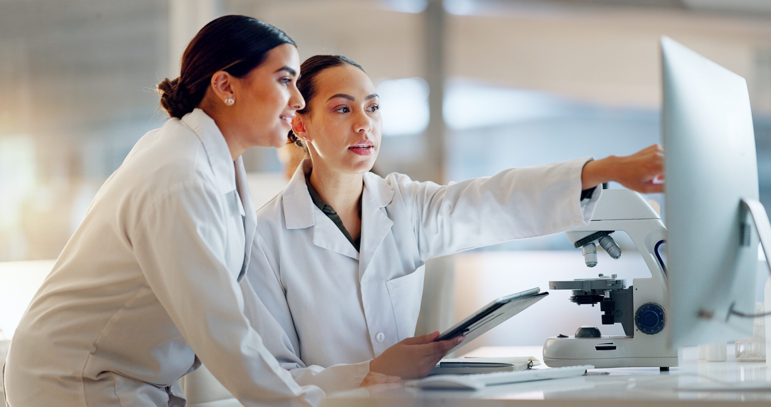 Scientists collaborating in laboratory setting