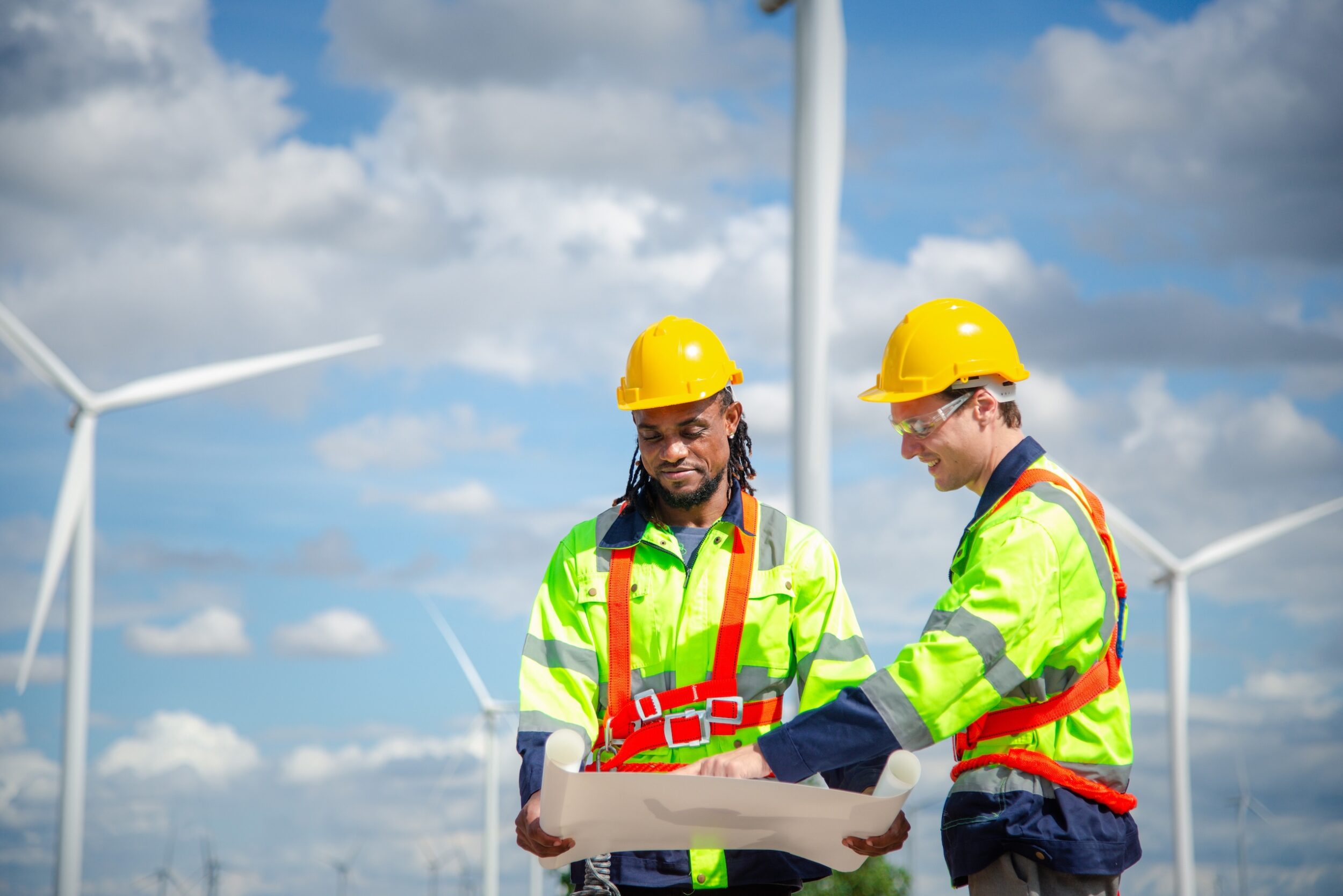 Technicians at construction site of wind turbine checking and maintenance Electricity wind generator