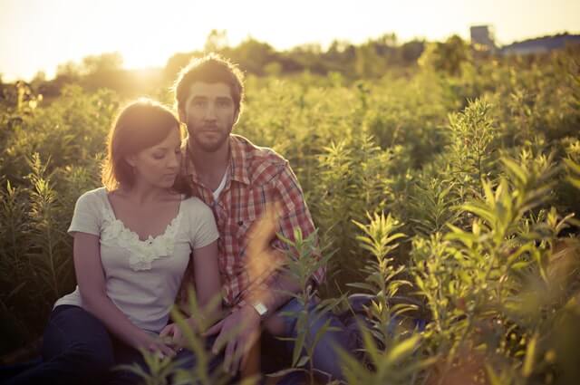 Couple posing in a regional field